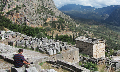 Student overlooking ruins abroad.