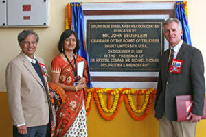 John D. Beuerlein posing in front of Hem Sheela.