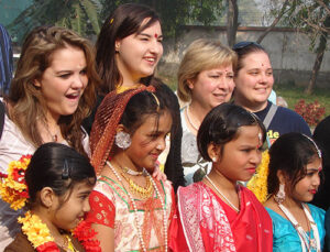 Group posing in front of the Hem Sheela School.