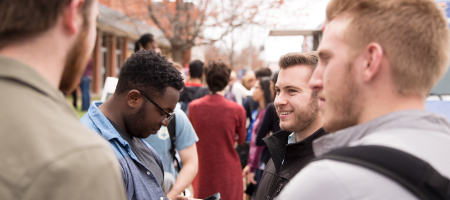 Students waiting in line for a food truck.