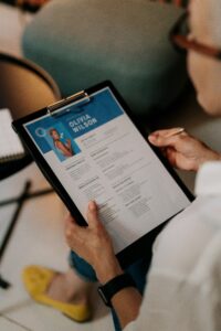 Person Holding Black Ipad With Black Case