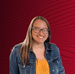 A portrait of Bethany Bryars, a Drury GO student. Her photo is cutout and is laid on top of an abstract red-black gradient background.